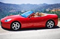 Woman, red sports car and road trip on weekend, travel and luxury transport on summer drive. Happy female person Royalty Free Stock Photo