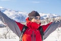 Woman in red sports jacket savors snow and breathtaking Norwegian landscape