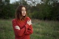 woman red sweater cool air nature romance Royalty Free Stock Photo