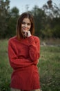 woman red sweater cool air nature romance Royalty Free Stock Photo