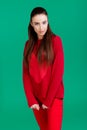 Woman in red sweater on green background Royalty Free Stock Photo