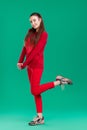 Woman in red sweater on green background Royalty Free Stock Photo