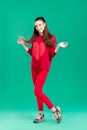 Woman in red sweater on green background Royalty Free Stock Photo