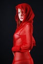 Woman in red transparent with hood