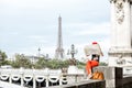 Woman in red traveling Paris