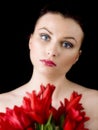 Woman with red tulips Royalty Free Stock Photo