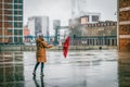 Woman with umbrella walking on the street Royalty Free Stock Photo