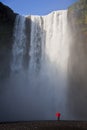 Woman With a Red Umbrella By A Waterfall Royalty Free Stock Photo