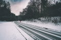 Woman with red umbrella on winter road Royalty Free Stock Photo