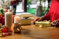 Woman preparing box to wrap gift with ribbon Royalty Free Stock Photo