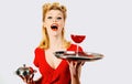 Woman with red wine. Alcohol presentation. Pin up waiter with wine and service tray. Restaurant serving. Studio isolated Royalty Free Stock Photo