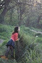 Woman in reeds and winged insect