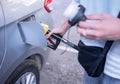 Woman refilling gasoline oil Royalty Free Stock Photo