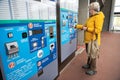 woman refills her electronic card at a machine for travel at a metro station. Washington Metro Royalty Free Stock Photo