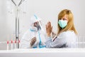 Woman refuses medical worker in PPE to perform nasal swab COVID-19 test in hospital lab Royalty Free Stock Photo
