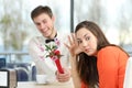 Woman rejecting a geek boy in a blind date Royalty Free Stock Photo