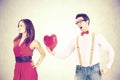 woman rejecting the red heart of her boyfriend in a Funny Valentine`s Day Royalty Free Stock Photo