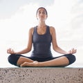 Woman, relax and lotus outdoor with yoga for zen, exercise and balance on mat with sky or concentration. Meditation Royalty Free Stock Photo