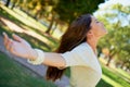 Woman, relax and peace with freedom in park on holiday or vacation in nature of forest or woods. Girl, stretching and Royalty Free Stock Photo