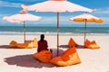 Woman relax on seat under parasol on summer beach Royalty Free Stock Photo