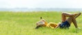 Woman relax and sleep chill in the meadow outdoor near sea beach