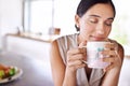 Woman, relax and smell coffee on kitchen or morning, enjoying and holding mug or cup. Female person, drinking tea or