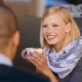 Woman, relax and smile in morning with coffee for start of day, together with friend and talking in cafe for catchup