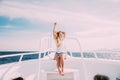 Woman relax in sunglasses on white yacht in on ocean waves Royalty Free Stock Photo