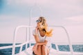 Woman relax in sunglasses on white yacht in on ocean waves Royalty Free Stock Photo