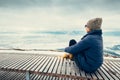 Woman relax in top view point with mountain city winter panorame