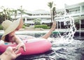 The woman relaxes on an inflatable circle in the pool Royalty Free Stock Photo