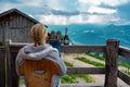 Woman relaxing on an alm hut hutte terrasse in tyrol with mountain view