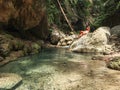 Woman alone on the green canyon in Dao Falls in Cebu Island, Philippines Royalty Free Stock Photo