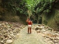 Woman alone on the green canyon in Dao Falls in Cebu Island, Philippines Royalty Free Stock Photo