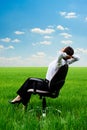 Woman relaxing in armchair at the meadow Royalty Free Stock Photo