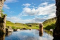 Woman relaxing and bathing in natural geothermal heated hot pool, hot spring in Iceland in summer. Royalty Free Stock Photo