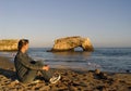 Woman relaxing on the beach Royalty Free Stock Photo