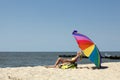 Woman relaxing on the beach Royalty Free Stock Photo