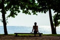 Woman relaxing on a beach bench. Summer vacation