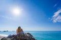 Woman relaxing on the beach in Greece Royalty Free Stock Photo