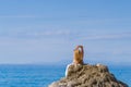 Woman relaxing on the beach in Greece Royalty Free Stock Photo