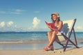 Woman Relaxing on the Beach Tranquil Tropical Concept