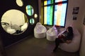 Woman relaxing in the beanbag in the old room remade as lounge zone