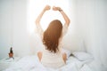 Woman Relaxing in bed and relaxing in her living room Royalty Free Stock Photo