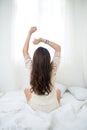 Woman Relaxing in bed and relaxing in her living room Royalty Free Stock Photo