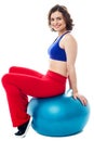 Woman relaxing on big exercise ball after workout Royalty Free Stock Photo