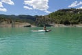 Woman relaxing breathing fresh air in a kayak in a lagoon