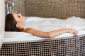Woman Relaxing In Bubble Bath. Body Care