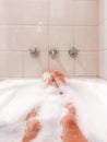 Woman Relaxing In A Bubble Bath