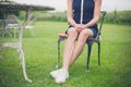 Woman relaxing on chair in a garden Royalty Free Stock Photo